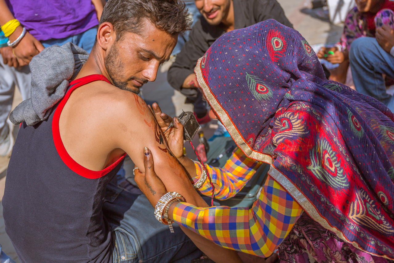 A tattoo in progress at Kullu Dussehra - Gods' Own Get-Together