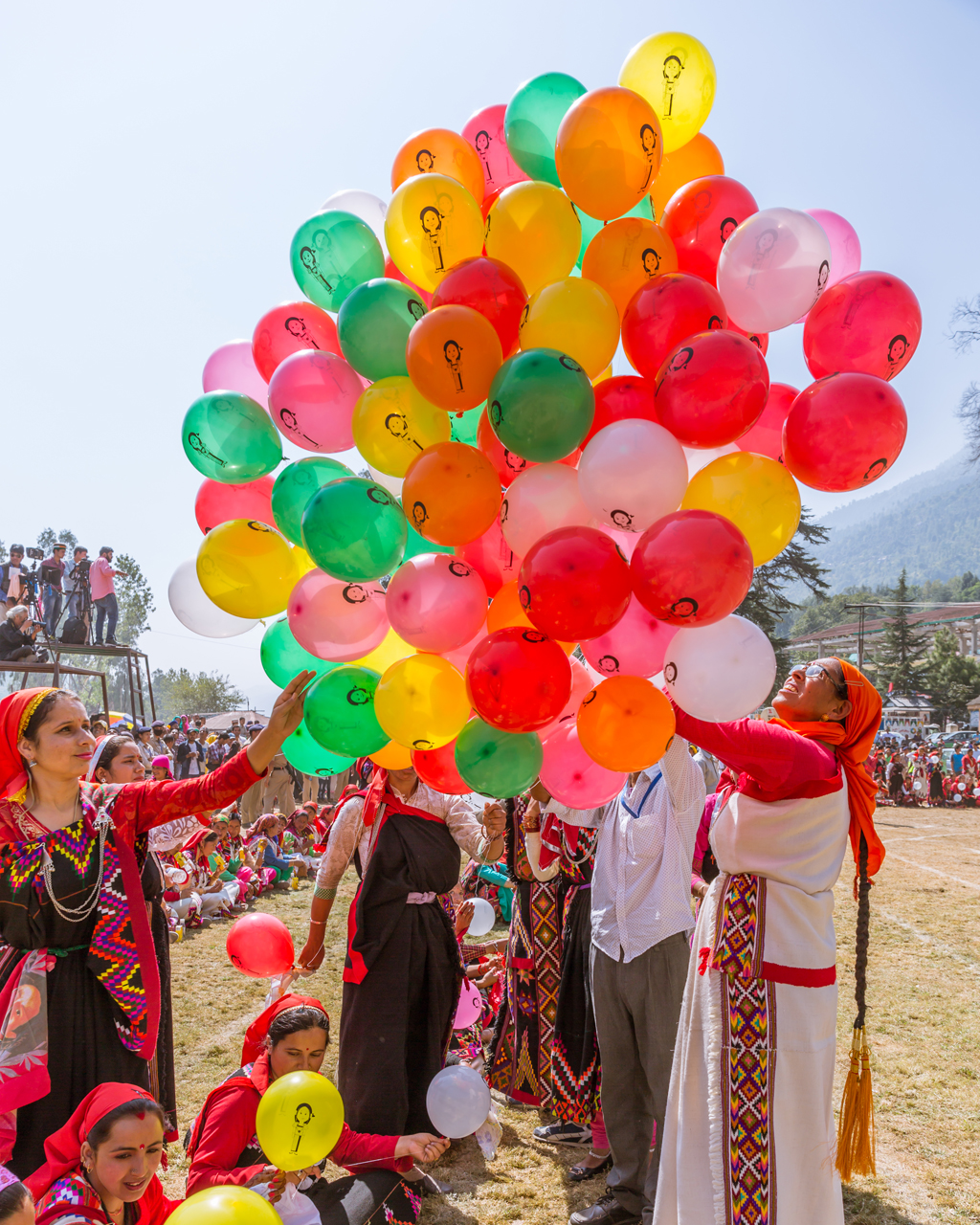 Helping herself to a balloon at Kullu Dussehra - Gods' Own Get-Together