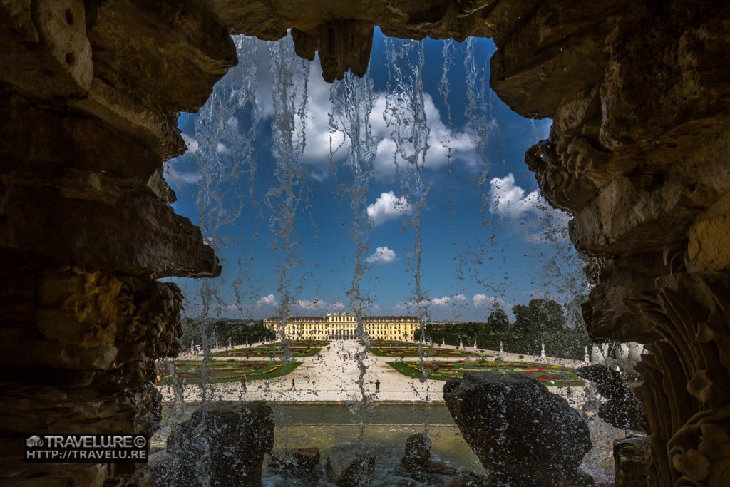 Schönbrunn Palace Vienna Austria as seen through the Neptune Fountain