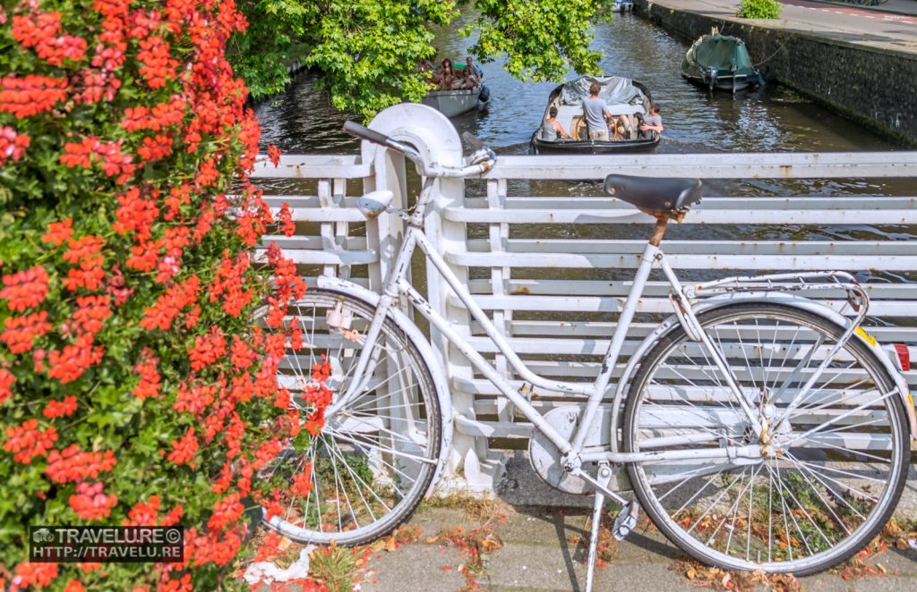 On one of the bridges of the Canals of Amsterdam Netherlands - Travelure ©