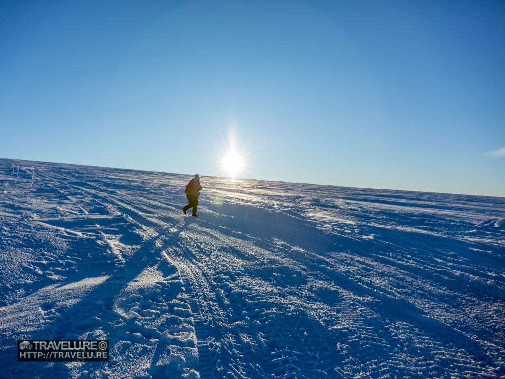 A solitary figure walks over the Long Glacier Langjökull Iceland - Travelure ©