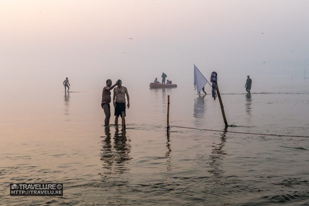 Devotees taking a holy dip at Triveni Sangam during Kumbh