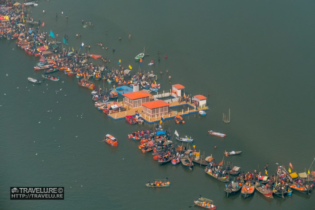 Boats anchored near sandbars at Triveni Sangam - shot from helicopter. Devotees come in these boats for holy dip. - Kumbh Mela India - World's Largest Gathering - Travelure ©