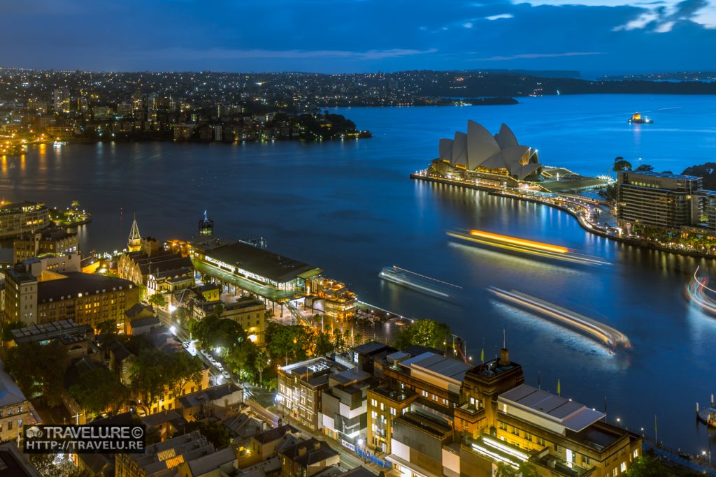 Long exposure enhances the iconic Sydney Opera House as the light trails of sailing boats frame this gem