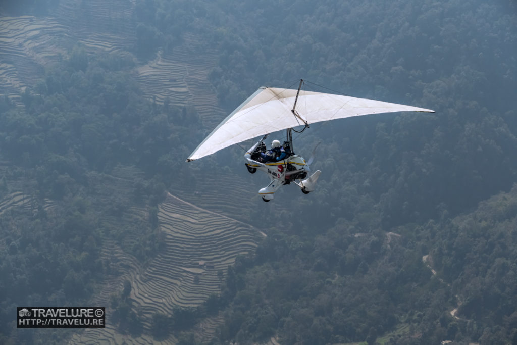 An ultralight plane soaring over Pokhara. Pokhara - The Jewel of Nepal - Travelure ©