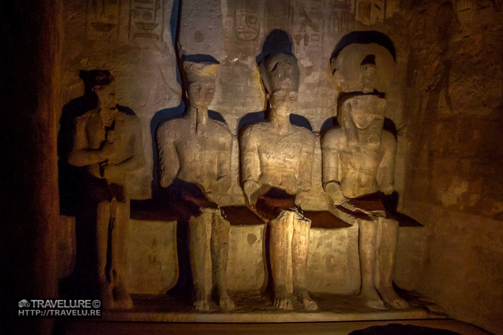 The entrance to the Temple of Ramesses II. The temple is dedicated to Amon-Ra, Ra-Harakhte, Ramesses II, and Ptah. Ptah doesn't get the light from the morning sun as it is the god of darkness. Abu Simbel Egypt - Travelure ©