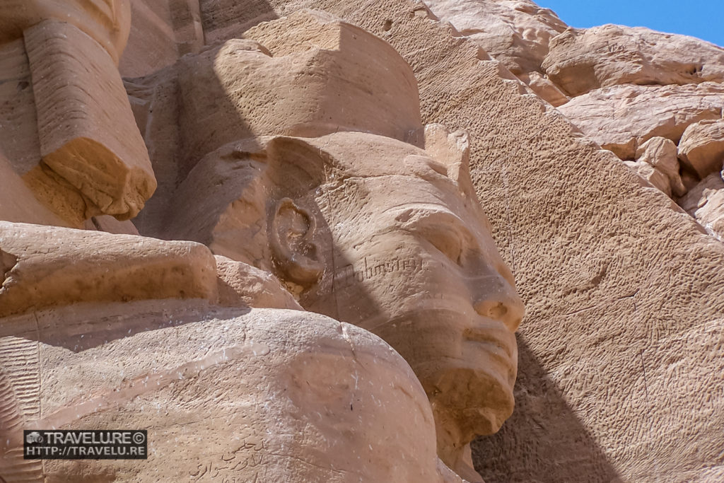 One of the guards outside the entrance to the Temple of Ramesses II. Abu Simbel Egypt - Travelure ©