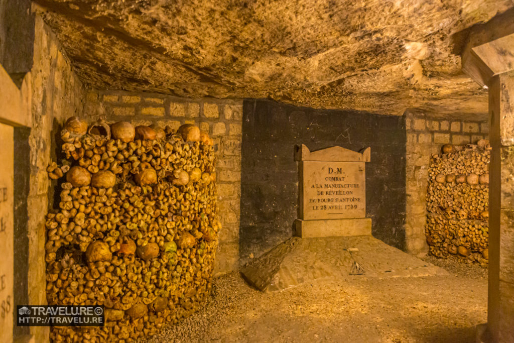 Carved stone markers meant to put some method to the cataloguing madness - the Catacombs in Paris - Travelure ©