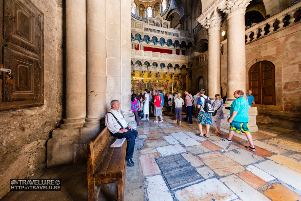 Man on bench is the holder of the key to the Church of the Holy Sepulchre, Jerusalem - Travelure ©