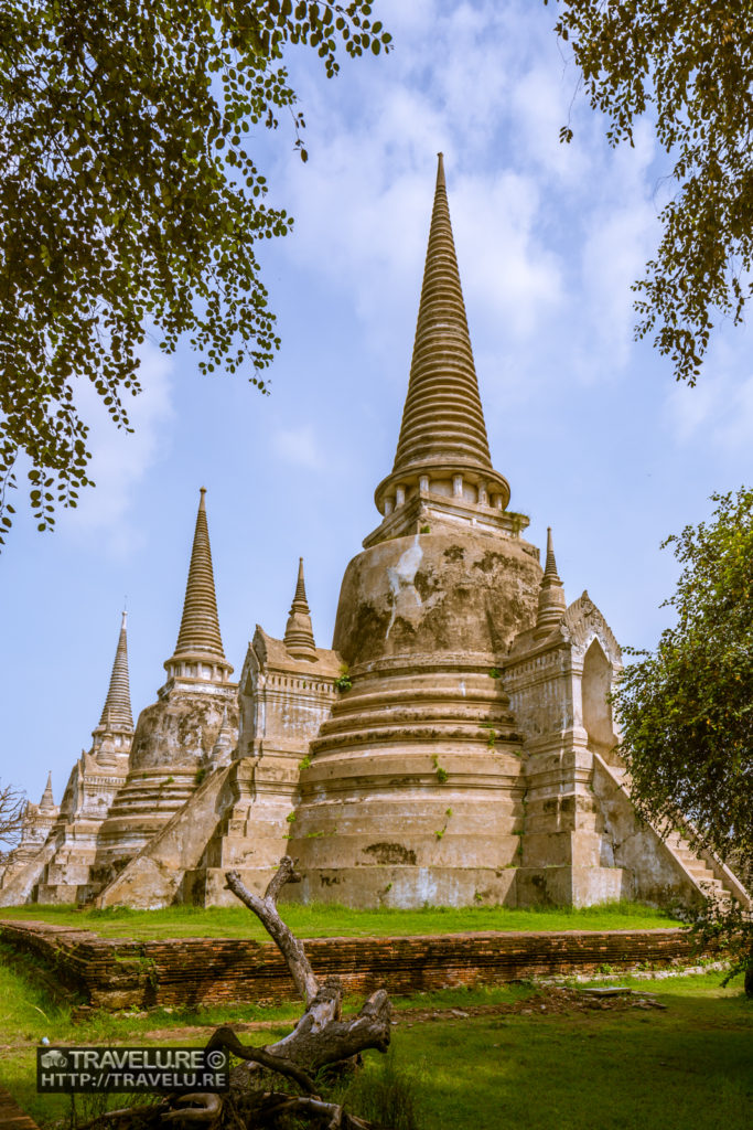 Wat Phra Si Sanphet is the most beautiful, important, and largest temple in the old capital of Ayutthaya. The three large chedis along its terrace recall the first three kings of Ayutthaya. The first two were built in 1492 and the third in 1540. - Travelure ©