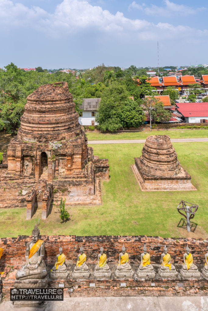 View of ruins of other minor temples around the precincts of Wat Yai Chai Mongkhon. The rows of Buddha statues are all around Wat Yai Chai Mongkhon. - Travelure ©