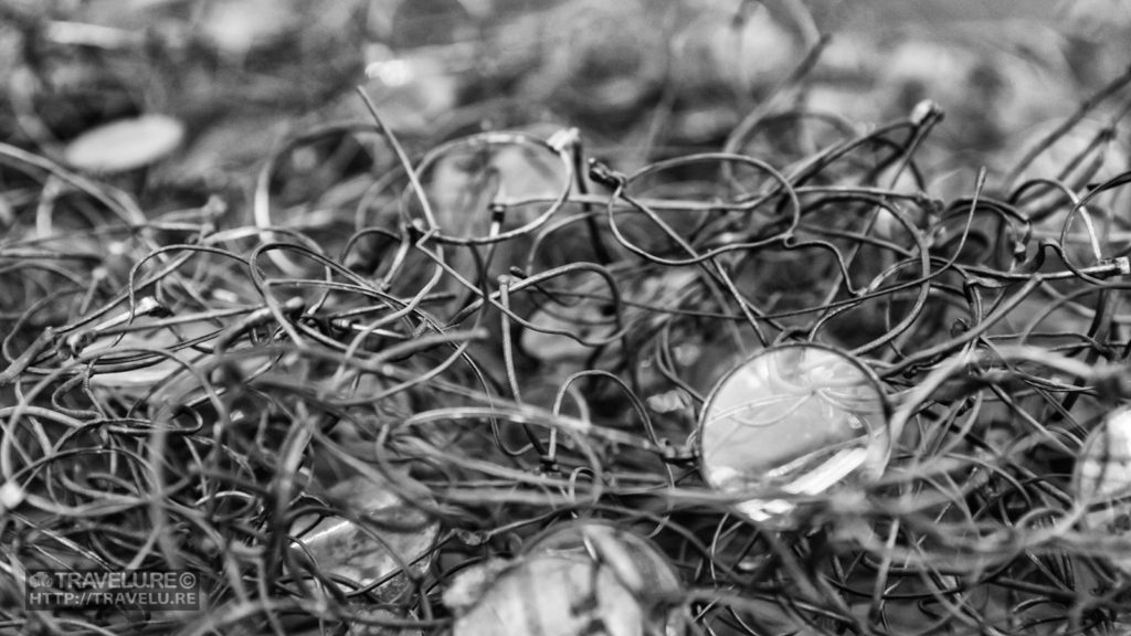 Holocaust Horrors: Auschwitz exhibit - mangled spectacles of prisoners - Travelure ©