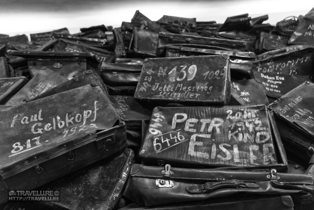 Holocaust Horrors: Suitcases of prisoners. The birth years mentioned on them show some of them were still teenagers when brought to Auschwitz - Travelure ©