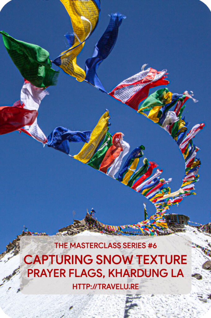 Modern-day cameras seem intelligent. In reality, they are dumb. No matter where you meter, the camera-meter tries to provide you exposure settings that turn the metered area 18% grey. - Capturing snow texture - Prayer flags, Khardung la - Travelure ©