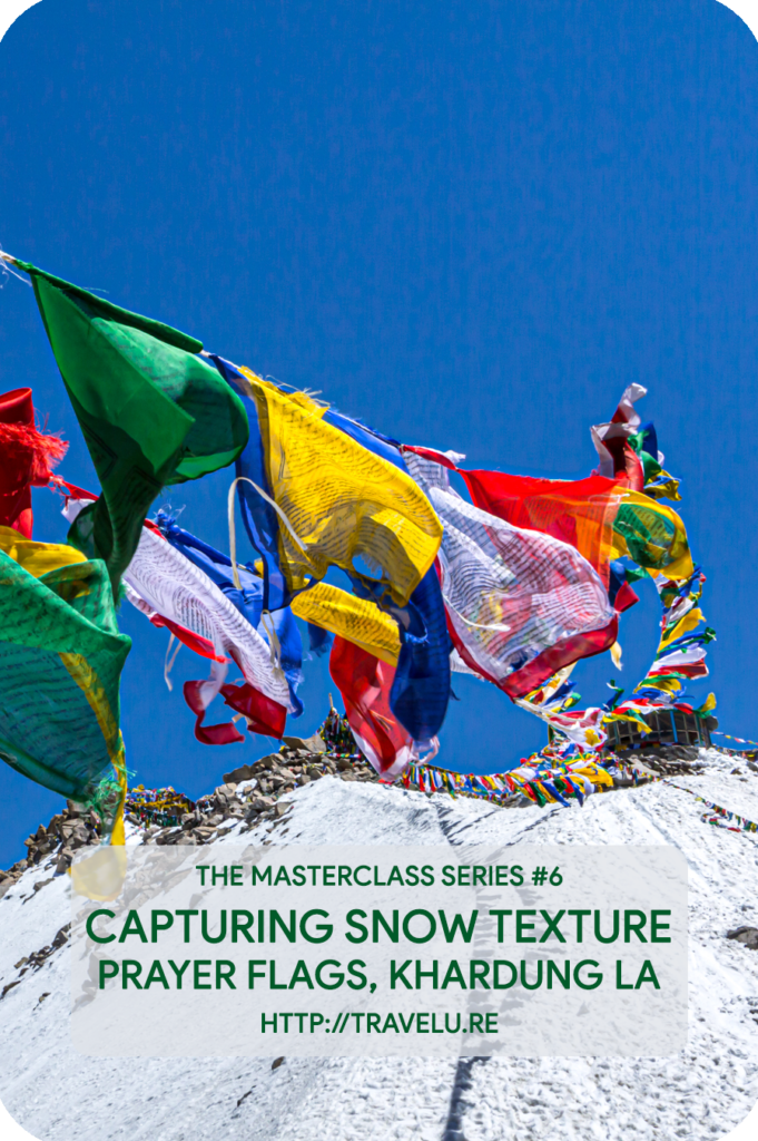 Modern-day cameras seem intelligent. In reality, they are dumb. No matter where you meter, the camera-meter tries to provide you exposure settings that turn the metered area 18% grey. - Capturing snow texture - Prayer flags, Khardung la - Travelure ©