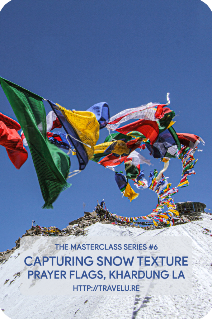 Modern-day cameras seem intelligent. In reality, they are dumb. No matter where you meter, the camera-meter tries to provide you exposure settings that turn the metered area 18% grey. - Capturing snow texture - Prayer flags, Khardung la - Travelure ©