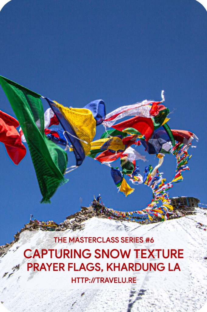 Modern-day cameras seem intelligent. In reality, they are dumb. No matter where you meter, the camera-meter tries to provide you exposure settings that turn the metered area 18% grey. - Capturing snow texture - Prayer flags, Khardung la - Travelure ©