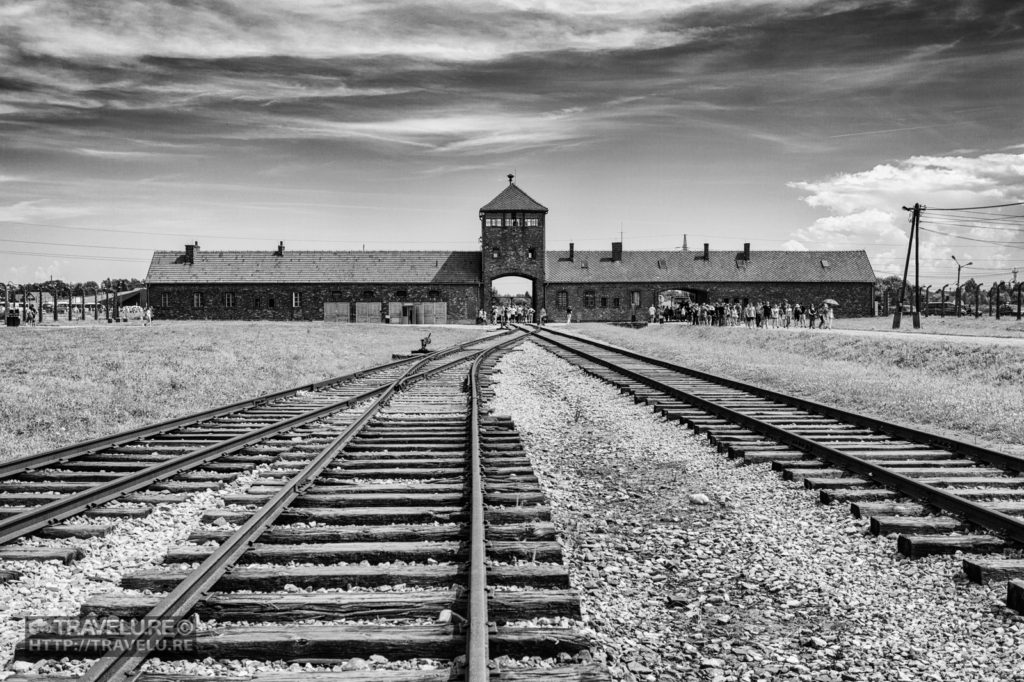 B&W reflects the sombre mood of this location (Gate of Death, Auschwitz, Poland) - Travelure ©