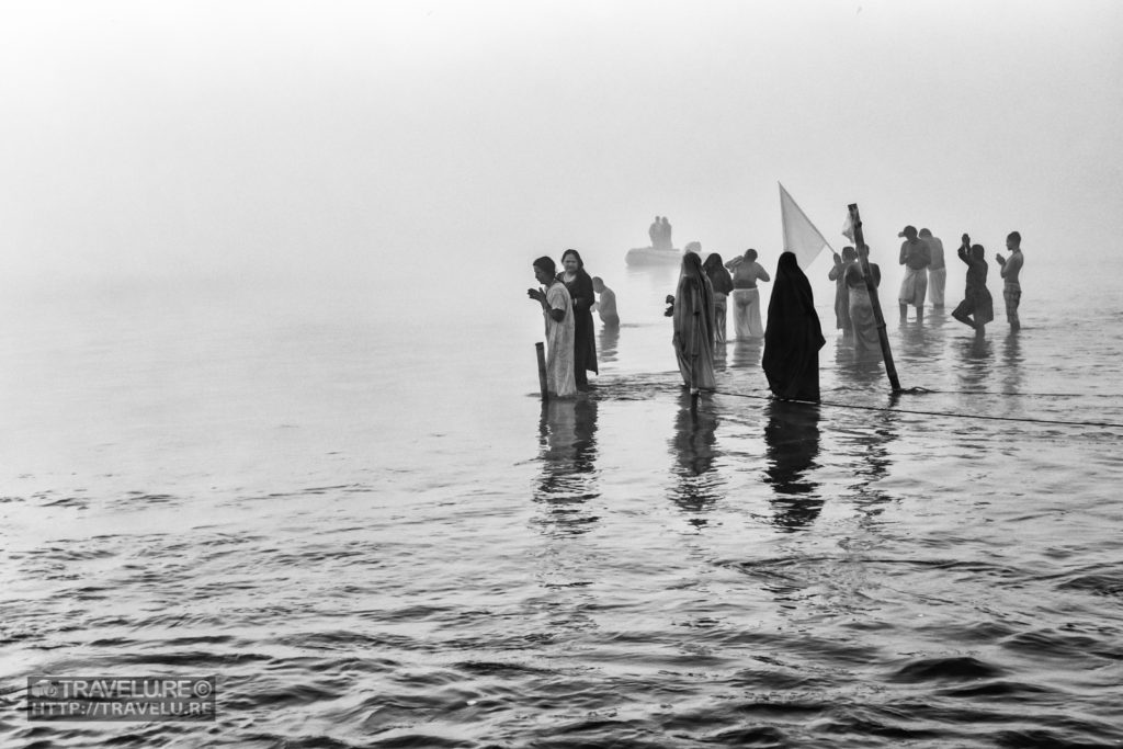 High-contrast shot of Kumbh Mahasnan at Prayagraj - Travelure ©