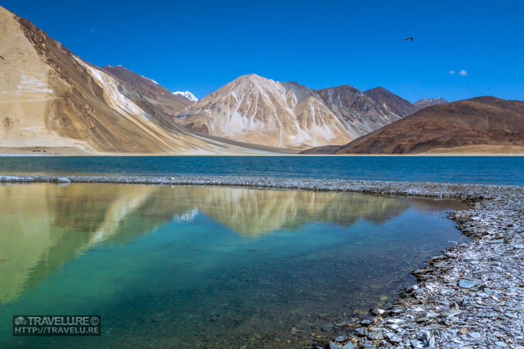 Shot #2: Reflection of barren mountains in pristine blue waters of Pangong Tso. EXIF: ISO 200; Focal Length 24mm; Aperture f/8; Shutter Speed 1/320. - Capturing a landscape - Travelure ©