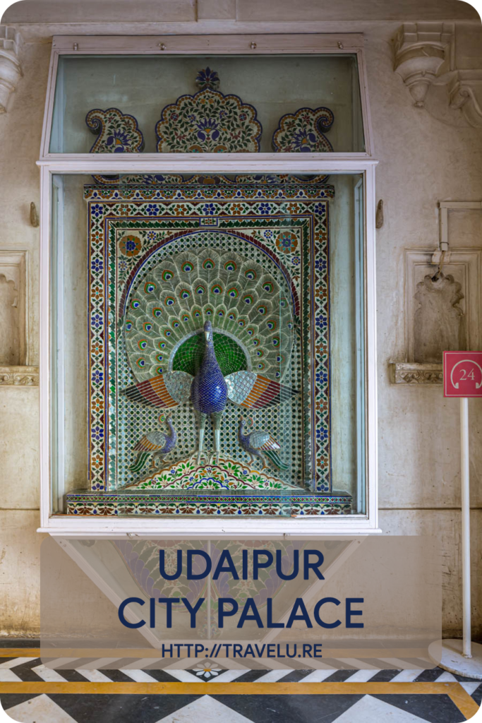 Calling it City Palace is misleading as it houses 11 different palaces. Those splendid palaces, though built by different rulers, bear a remarkable similarity. Many towers, domes, and arches embellish this complex. - Udaipur City Palace - Travelure ©