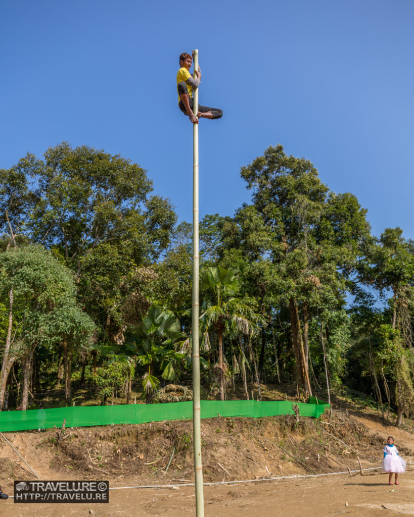 Skill, strength, determination - all of them needed to climb this oiled bamboo - Travelure ©