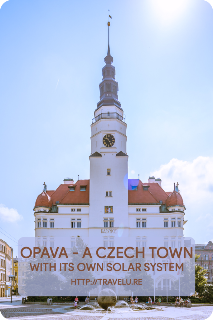 Just in front of the town hall, a round stone ball lies in the centre of a fountain. This 230-cm ball represents the sun. - Opava - A Czech Town with its own Solar System - Travelure ©