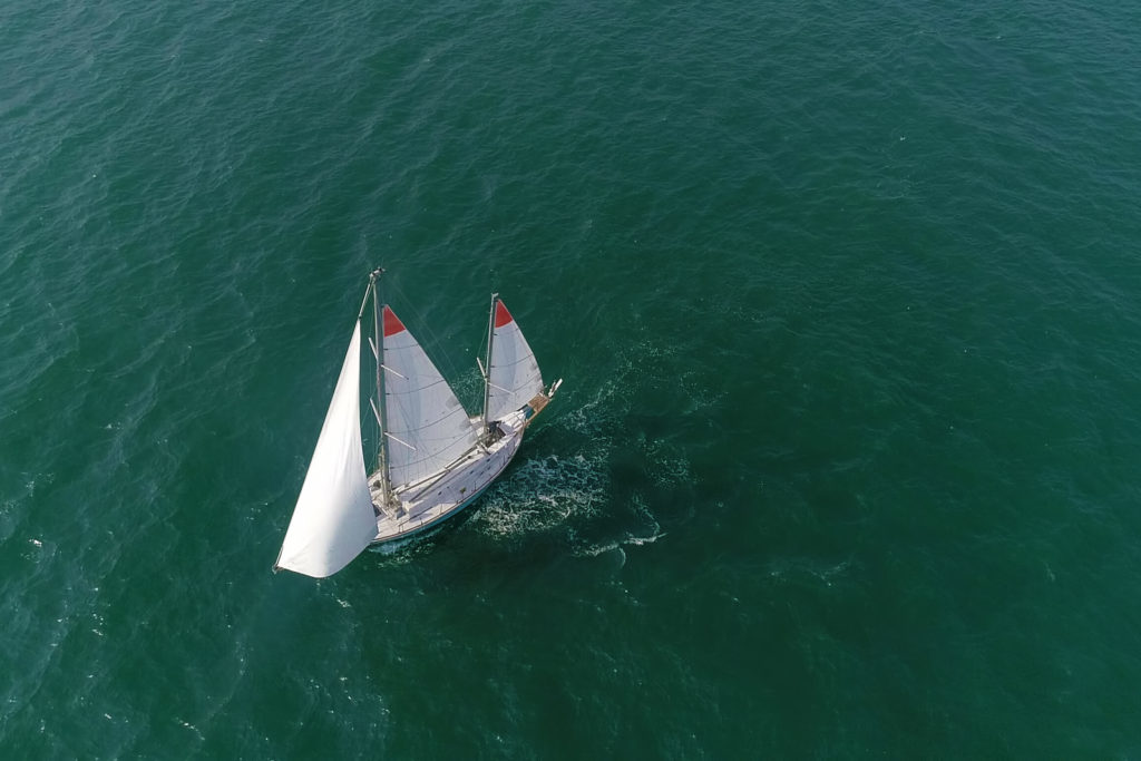 An aerial shot of Abhilash's GGR 2018 sailboat Thuriya - Travelure ©