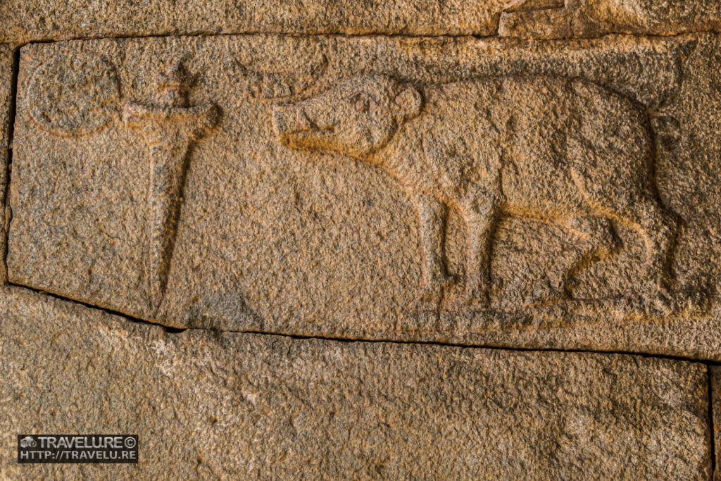 Vijayanagara Empire's carved insignia comprising the sun, a dagger, the moon, and a boar - Travelure ©