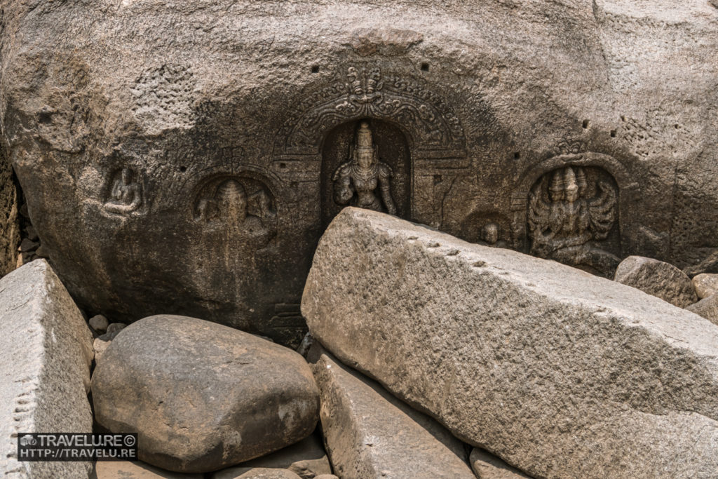 A set of god idols tucked within the rocks along the river bank - Travelure ©