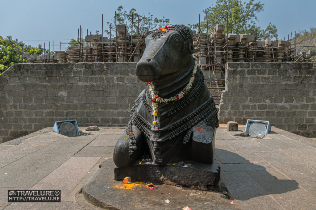 You can see the under-restoration mandapam behind Nandi bull - Travelure ©